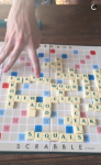 Harry Styles joacă Scrabble în halat cu modelul Georgia Fowler