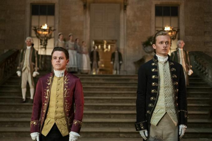 Queen charlotte a bridgerton story l to r sam clemmet as young brimsley, freddie dennis as reynolds in episode 102 of queen charlotte a bridgerton story cr nick wallnetflix © 2023